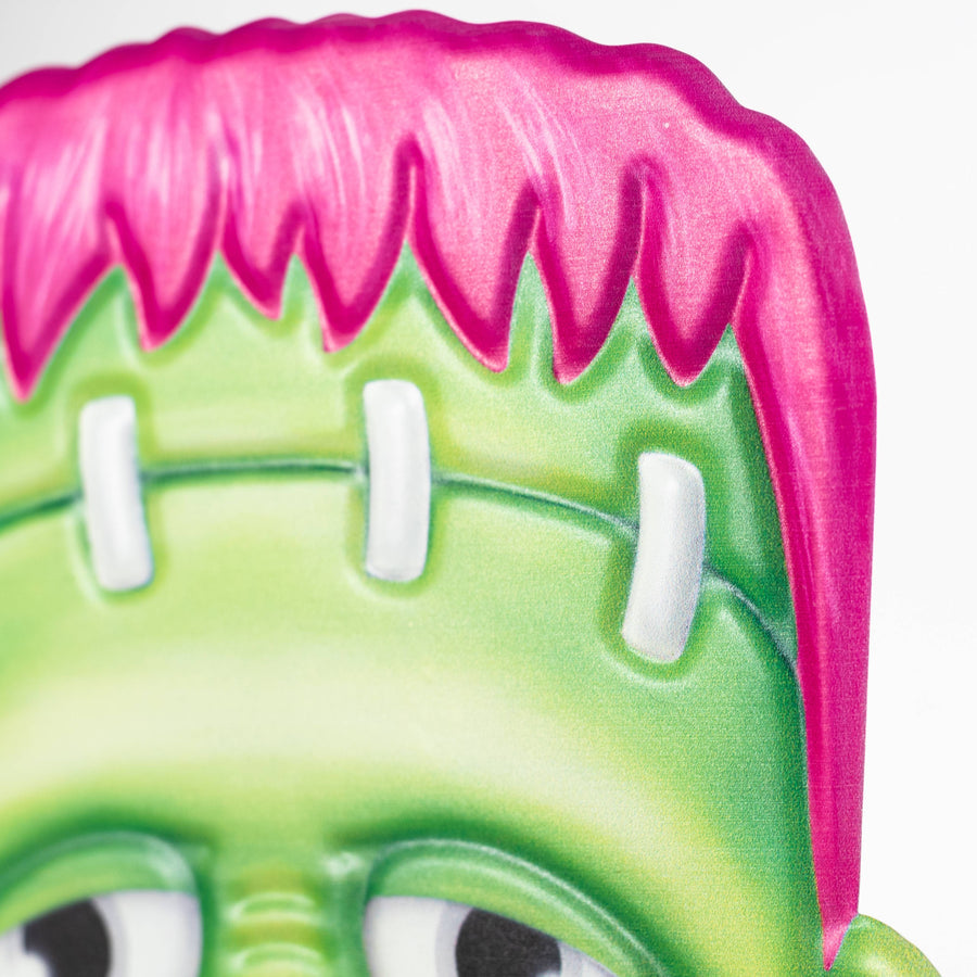 10"L x 7.25"H Metal Embossed Pink Frankenstein Sign
